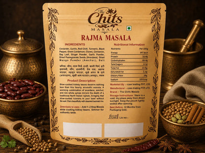 The Chit Masala Rajma Masala seasoning packet shown standing upright, with ingredients and nutrition information printed on the front. The packet is styled on a dark surface with spices, star anise, and bowls of whole spices around it.