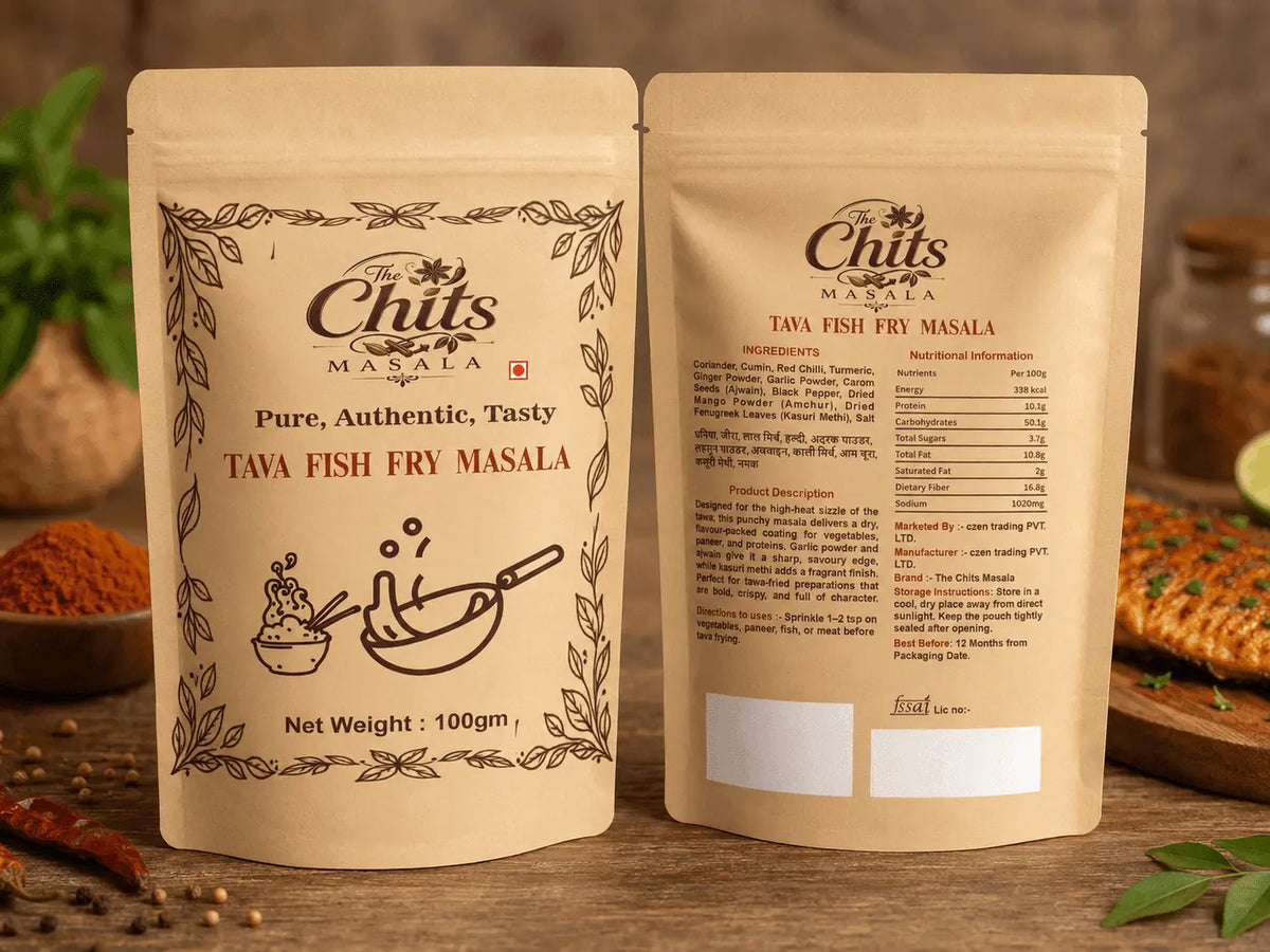 Two stand-up pouches of Chits Masala Tava Fish Fry Masala displayed side by side on a rustic wooden surface with spices and food props in the background.